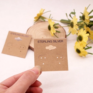 Brown kraft jewelry display card for earrings featuring Sterling Silver print text