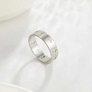 Minimalist silver stainless steel ring featuring hollow cross patterns for men and women