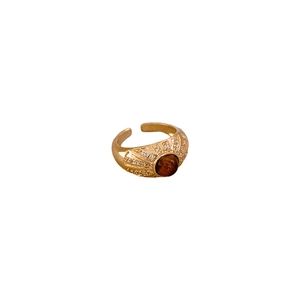 Vintage gold adjustable ring with brown tiger eye stone and zircon accents on white background