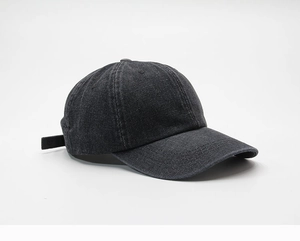 Detail of dark grey washed denim baseball cap showing side profile and fabric texture