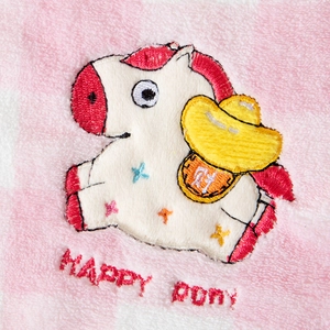 Detail of embroidered happy pony with gold ingot on pink checkered coral fleece towel