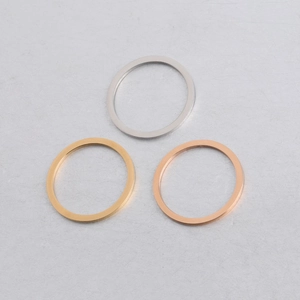 Detailed view of silver, gold, and rose gold 25mm mirror finish stainless steel rings