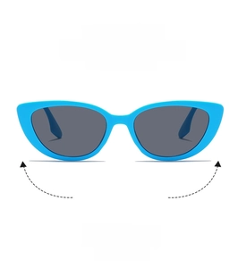 Detail view of retro bright blue cat eye sunglasses with dark grey lenses and wide frames