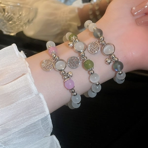 Set of three vintage Chinese style cat eye bead bracelets with silver Fu character charms