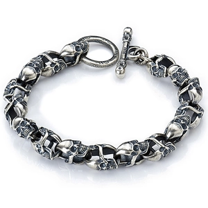 Silver punk skull link bracelet with T-bar clasp and 925 stamp in professional studio lighting