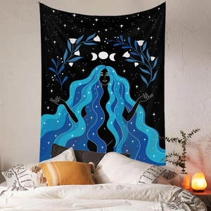 Detail of bohemian tapestry featuring a goddess with moon phases on a bedroom wall