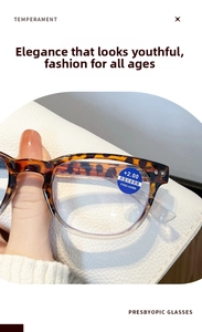 Detail of tortoiseshell reading glasses with +2.00 anti-blue light lens and metal rivets