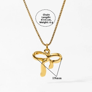 Detailed view of golden bow pendant necklace with dimensions 41+5cm and 19mm size
