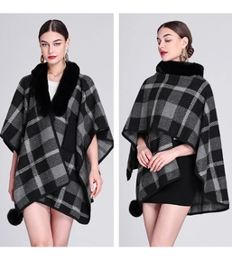 Detail view of black and grey plaid knit shawl with faux rabbit fur collar and pompom trim
