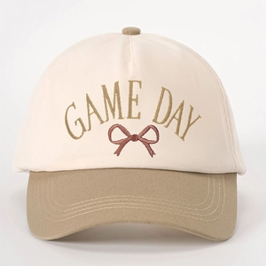 Two-tone beige and khaki baseball cap with gold GAME DAY embroidery and bow design