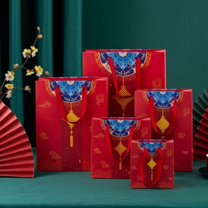 Chinese New Year red gift bags with gold cloud patterns and wide handles in five sizes