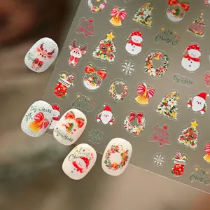 Watercolor Christmas nail stickers with Santa, reindeer and tree patterns for DIY manicure