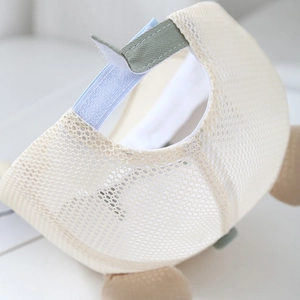 Detail of breathable mesh baseball cap with velcro strap and plush bear ear accents