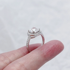 Close-up of a s925 silver wedding ring featuring a large square zircon on a finger
