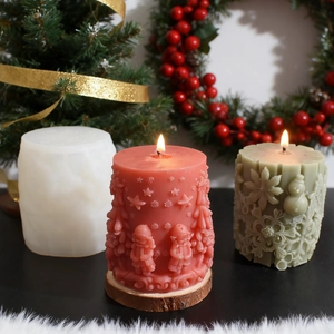Macro view of Christmas cylinder candle silicone mold featuring embossed elk and snowman