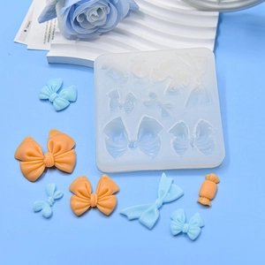 Silicone fondant mold with multiple bow and candy shapes for cake and clay decoration