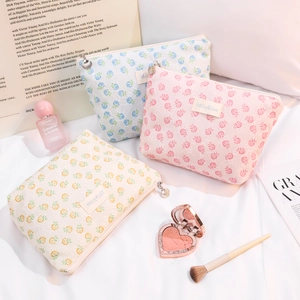Set of elegant floral lace cosmetic bags with shell zipper pulls in multiple pastel colors