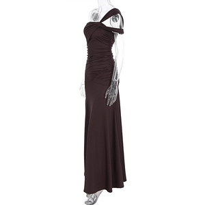Detail of ruched texture and side slit on a chocolate brown one-shoulder maxi dress