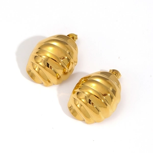 Macro shot of 18k gold plated titanium steel earrings with honeycomb croissant texture
