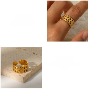 Macro view of gold adjustable double-layer chain ring showing hollow metal link texture
