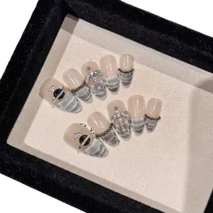 Handmade gradient snakeskin press-on nails with punk cross and planet pendants