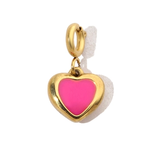 Macro shot of a pink heart charm with gold steel border and spring ring clasp