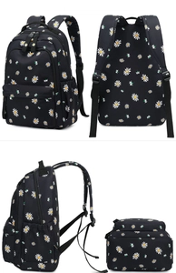 Multiple views showing black nylon backpack with white daisy patterns and side pockets