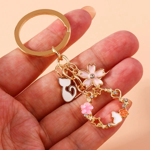 Cute white cat and cherry blossom keychain with gold metal ring and sparkling rhinestones