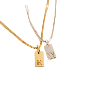 Gold and silver square pendant necklace with alphabet R and W on a box chain