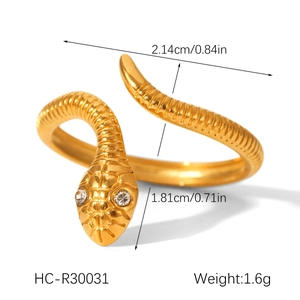 Detail view of gold snake ring with zircon eyes including size and weight dimensions