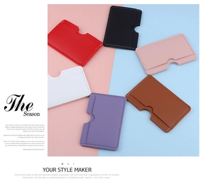 Flat lay of colorful minimalist slim leather card holders in six vibrant fashion colors