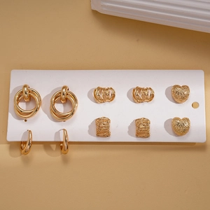 Set of 6 pairs of gold geometric earrings including heart and hoop designs