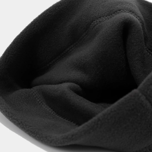 Macro shot of soft black fleece inner lining with neat stitching for winter warmth accessories