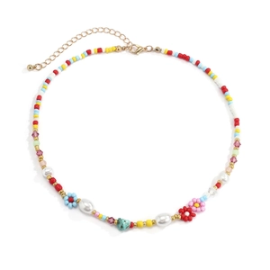 Detail of bohemian daisy beaded necklace featuring colorful beads and gold lobster clasp
