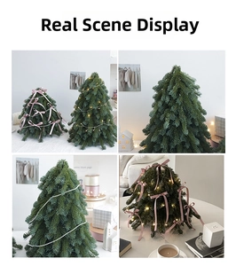 Close-up of artificial Noble Fir mini tree with warm LED lights and pink silk bows