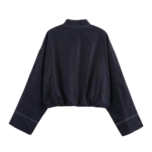 Cropped dark denim jacket with white contrast stitching and elastic hem back view