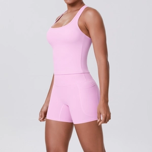 Detail of pink high-waisted yoga shorts with functional side pocket and flatlock seams