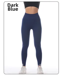 Detail view of high-waisted seamless dark blue yoga pants with moisture-wicking fabric