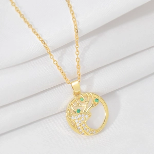 Golden titanium necklace with cat eye deer pendant and crystals on white silk