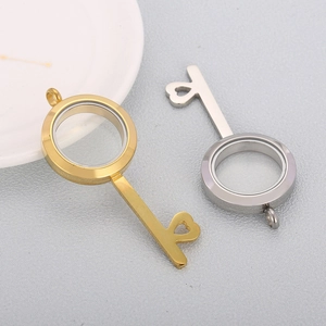 Key shaped stainless steel photo locket pendants in gold and silver with heart cutouts