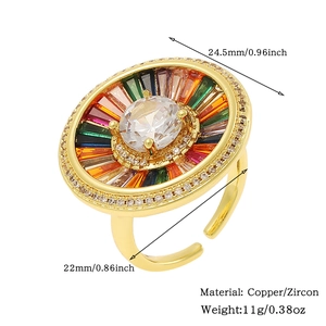 Detailed view of a gold ring featuring a large clear zircon and colorful accents