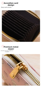 Detail of pink cartoon accordion card holder featuring smooth metal zipper and slots
