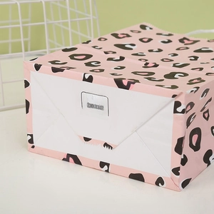 Pink leopard print kraft paper gift bag with stable base and size tag 21x15x8cm