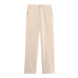 Detailed shot of beige tailored trousers with single button closure and crisp side pockets