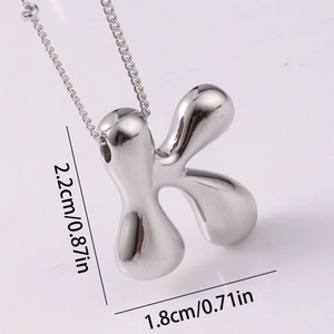 Detailed view of silver letter K pendant with dimensions 2.2cm showing polished finish