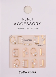 Detail of 5D white pearls in gold metal frames for nail art decoration, model MJ-037