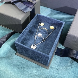 Navy blue velvet jewelry gift box set with butterfly necklace and floral earrings