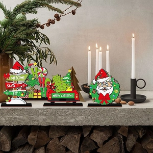 Christmas wooden Santa table signs on a fireplace mantel for holiday party home decor