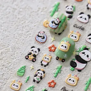 Macro detail of 3D panda and bamboo embossed nail art stickers on light green nails