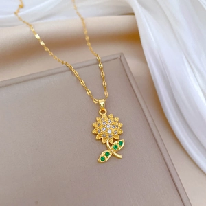 Luxurious gold titanium necklace with sunflower pendant and green crystals on silk